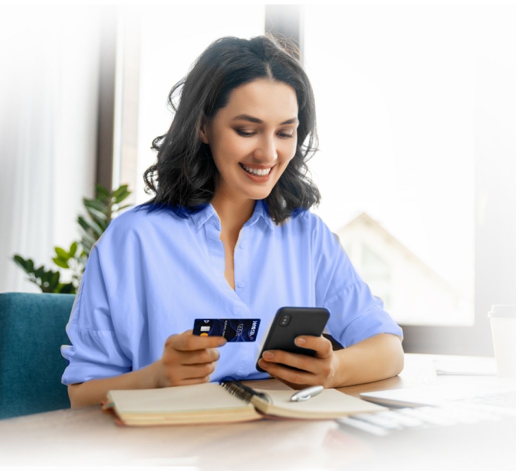 Woman with credit card and phone